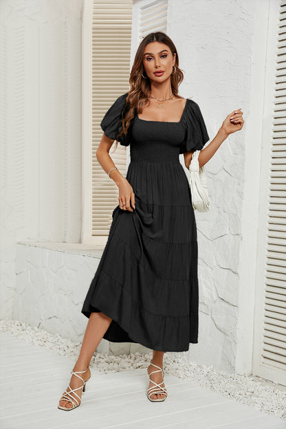 Robe de couleur unie à taille haute et à manches bulles